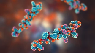 3D illustration of colorful molecules with clustered blue and red spheres on a blurred brown-orange background, conveying a scientific and dynamic feel.